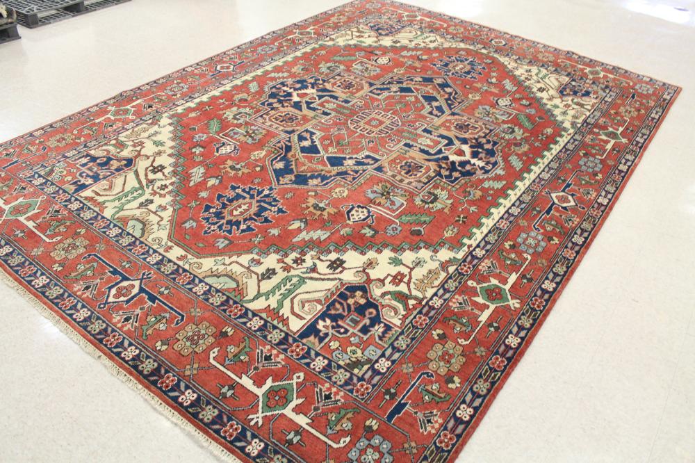 Appraisal: HAND KNOTTED ORIENTAL CARPET Persian Serapi or Heriz design centering