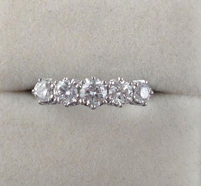 Appraisal: A diamond five stone ring The brilliant cut diamonds are