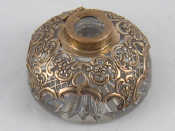 Appraisal: A pierced and embossed silver cased glass inwell cover missing