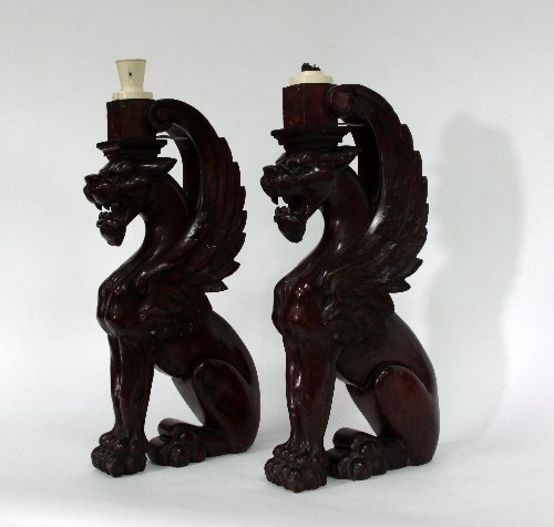 Appraisal: A pair of Victorian carved mahogany griffins fitted as lamp