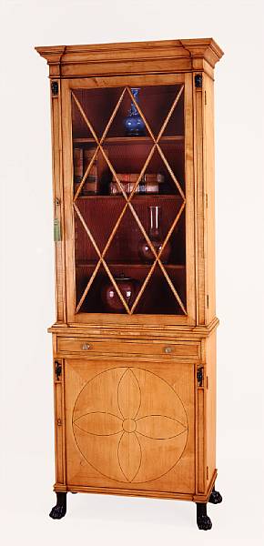 Appraisal: A pair of Regency style parcel ebonized maple bookcase cabinets