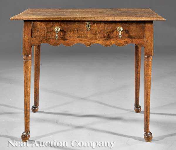 Appraisal: A George II Oak Lowboy th c molded top shaped