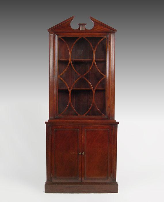 Appraisal: DIMINUTIVE MAHOGANY CORNER CUPBOARD Broken arch pediment over single glass