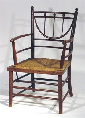 Appraisal: A rush seated ash Sussex armchair possibly Morris Co cm