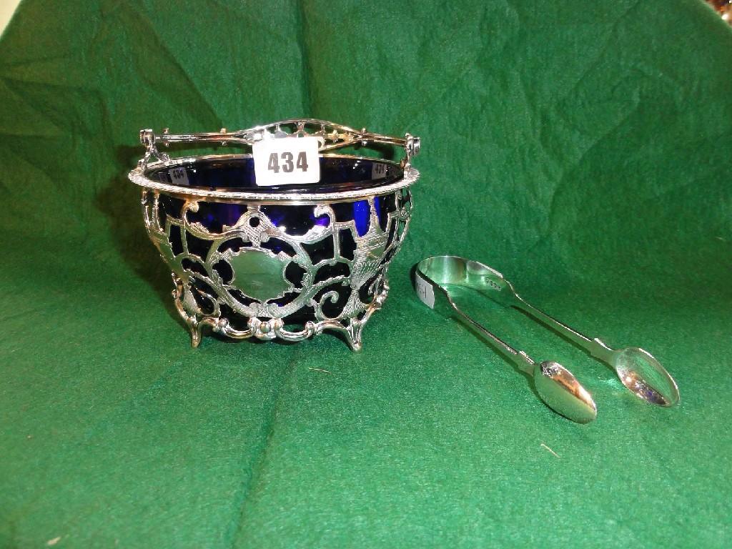 Appraisal: A classical style silver basket with loop handle pierced decoration