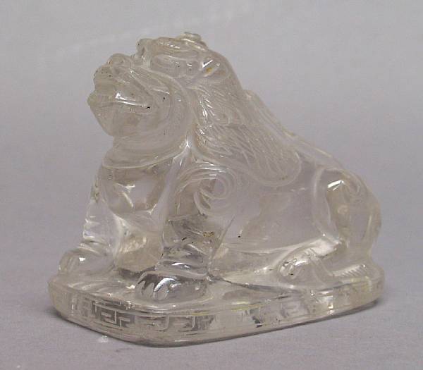 Appraisal: A rock crystal crouching lion dog in long