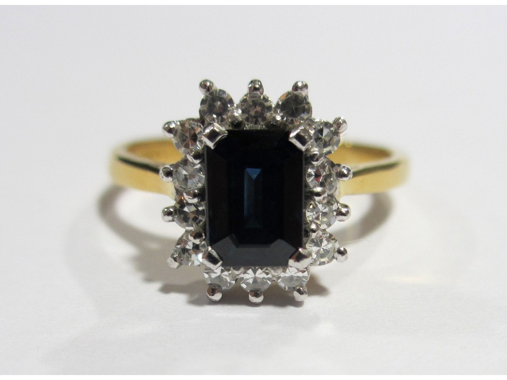 Appraisal: A sapphire and diamond cluster ring the rectangular step cut