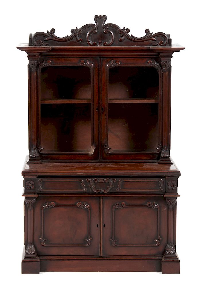 Appraisal: A Victorian Diminutive Carved Mahogany Step-Back Cabinet A Victorian Diminutive