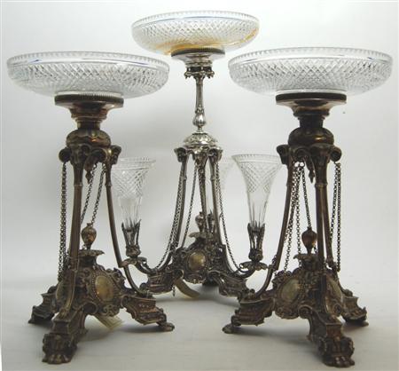 Appraisal: A silver plated epergne garniture comprising centre piece with trefoil