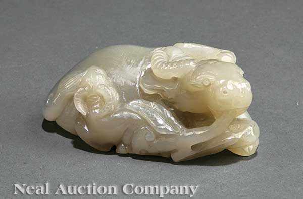 Appraisal: A Chinese Pale Gray Jade Buffalo Group carved as a