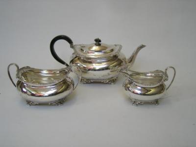 Appraisal: AN EDWARDIAN THREE PIECE TEA SET maker David Herbert Edward