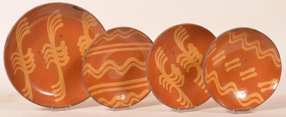 Appraisal: Greg Shooner Redware Slip Decorated Plates Four Greg Shooner Redware