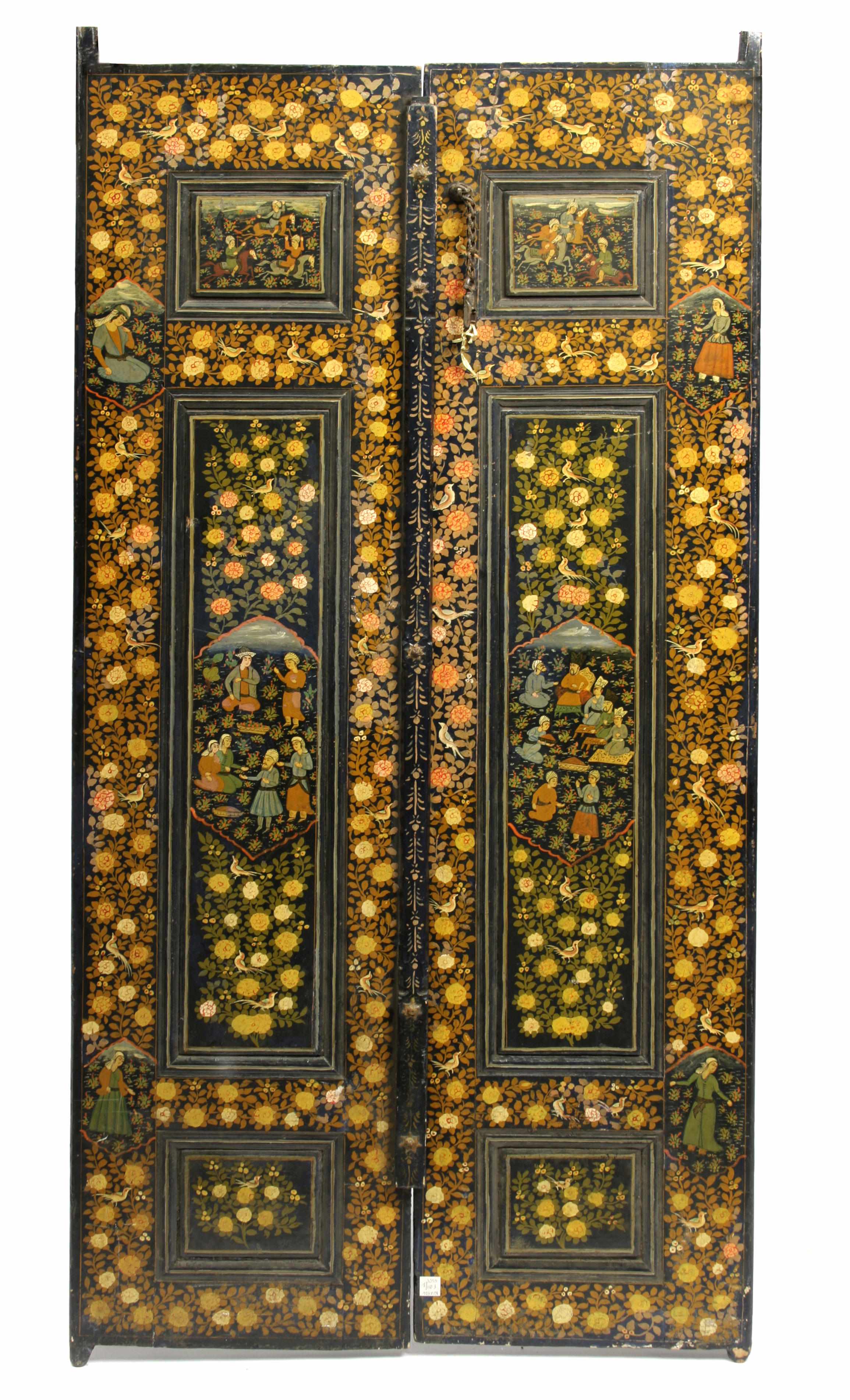 Appraisal: A pair of Persian polychrome wood paneled doors height in