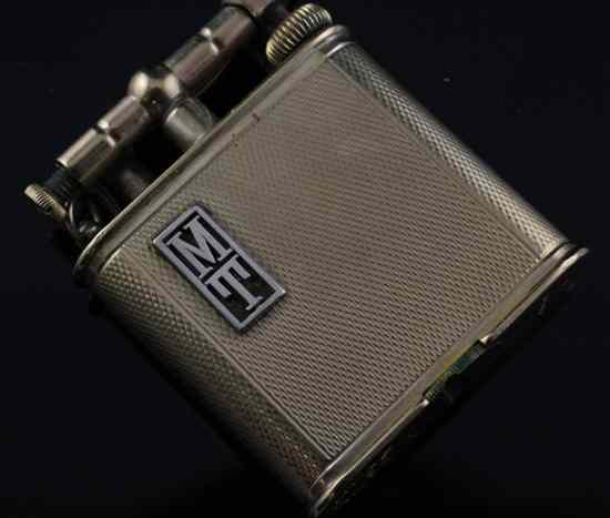 Appraisal: An Alfred Dunhill ct gold cased petrol lighter in Estimate