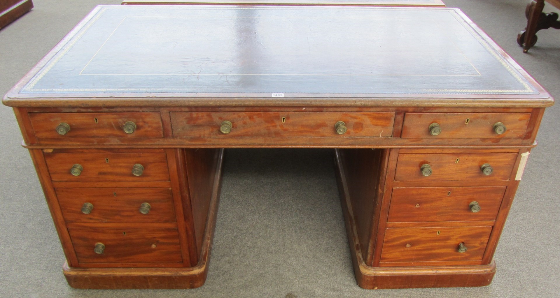 Appraisal: A th century mahogany pedestal desk with nine drawers about