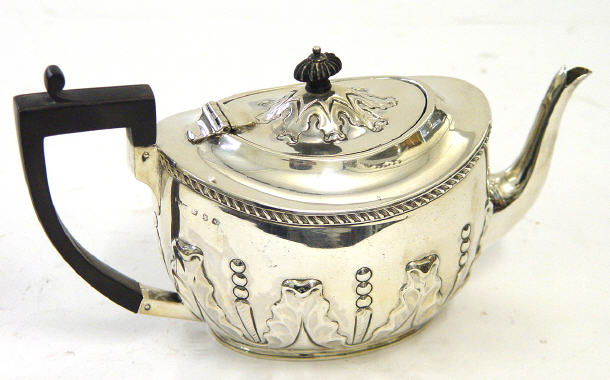 Appraisal: Victorian silver teapot with ebony knop and handle embossed with