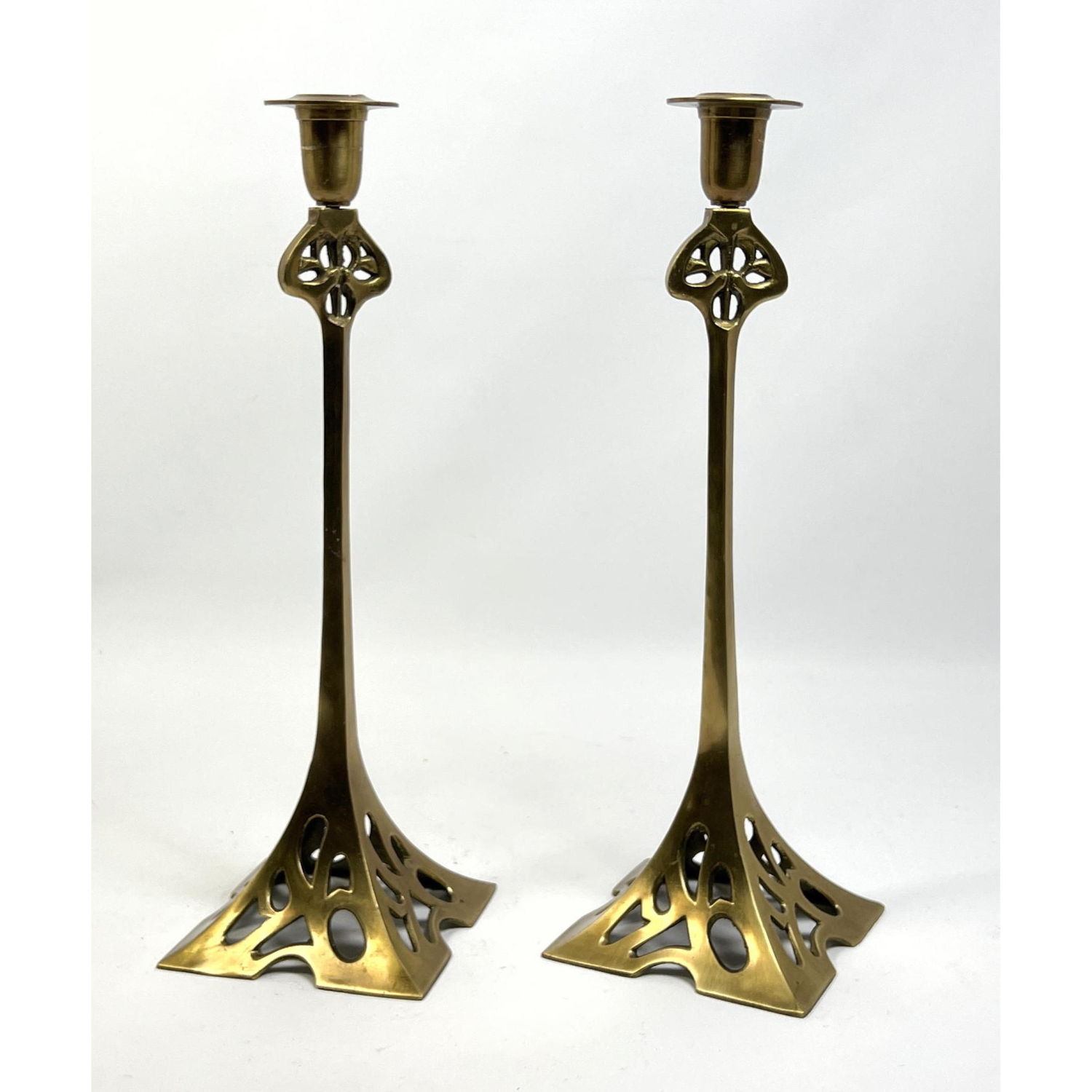 Appraisal: Pr Tall Brass Art Nouveau Candlesticks Flared pierced Bases Dimensions