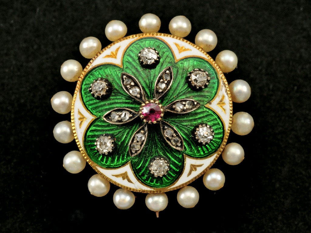 Appraisal: A Diamond Ruby Pearl and Enamel Brooch the central circular-cut