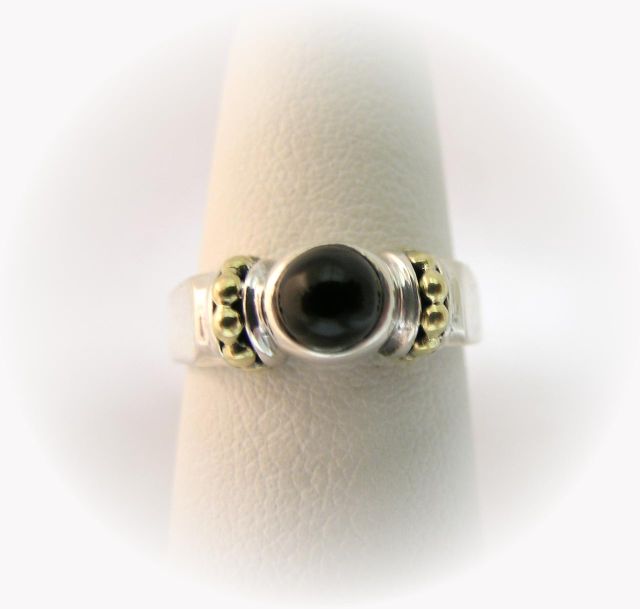 Appraisal: Lagos Caviar designer lady's sterling and K yellow gold ring