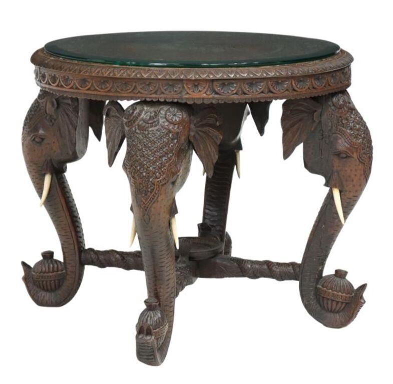 Appraisal: Elaborately carved hardwood side table India glass plate over circular