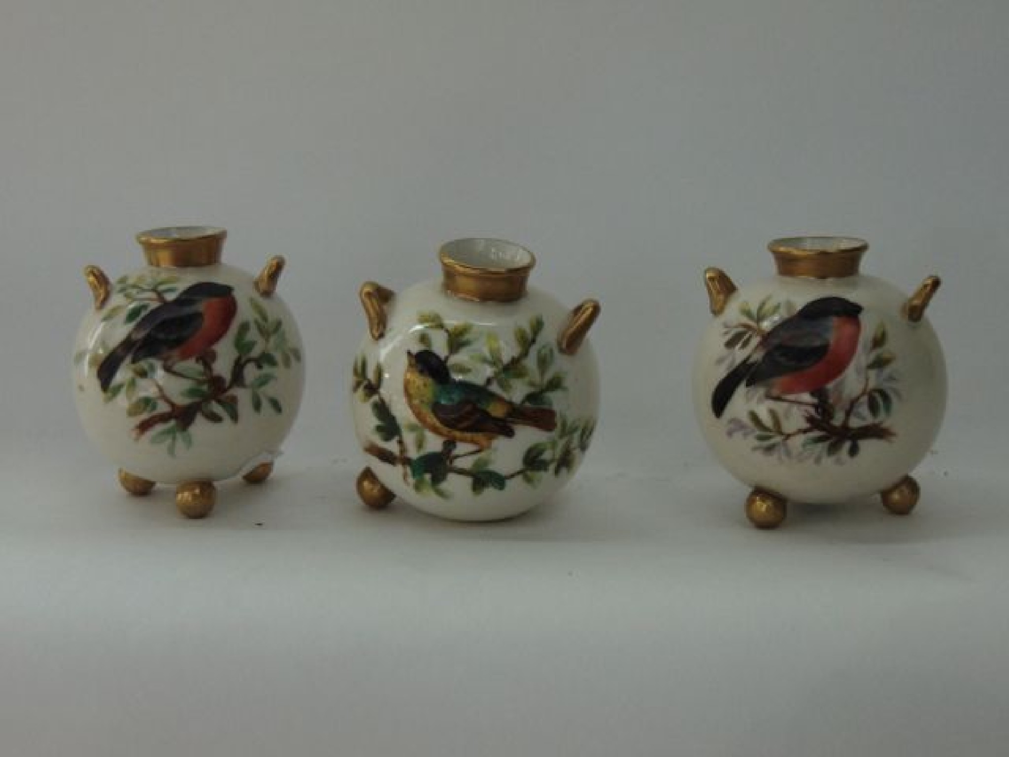 Appraisal: A set of three ivory ground Royal Worcester two handled