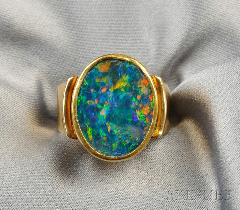 Appraisal: kt Gold and Assembled Opal Ring Janiye bezel-set with an