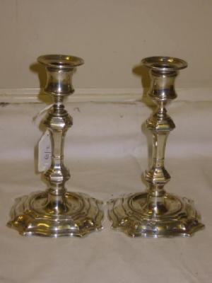 Appraisal: A PAIR OF CANDLESTICKS with reeded drip trays square section