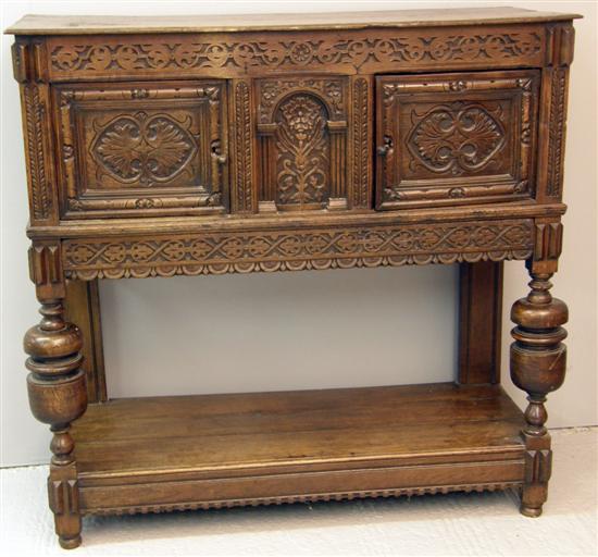 Appraisal: Oak cupboard in th century style two carved doors above