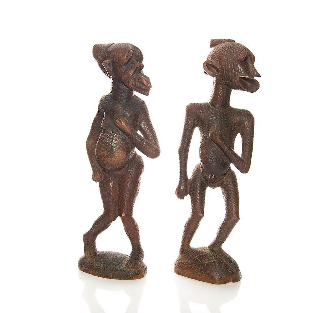 Appraisal: PAIR OF HAND CARVED AFRICAN MATERNITY STATUETTES Standing pregnant women