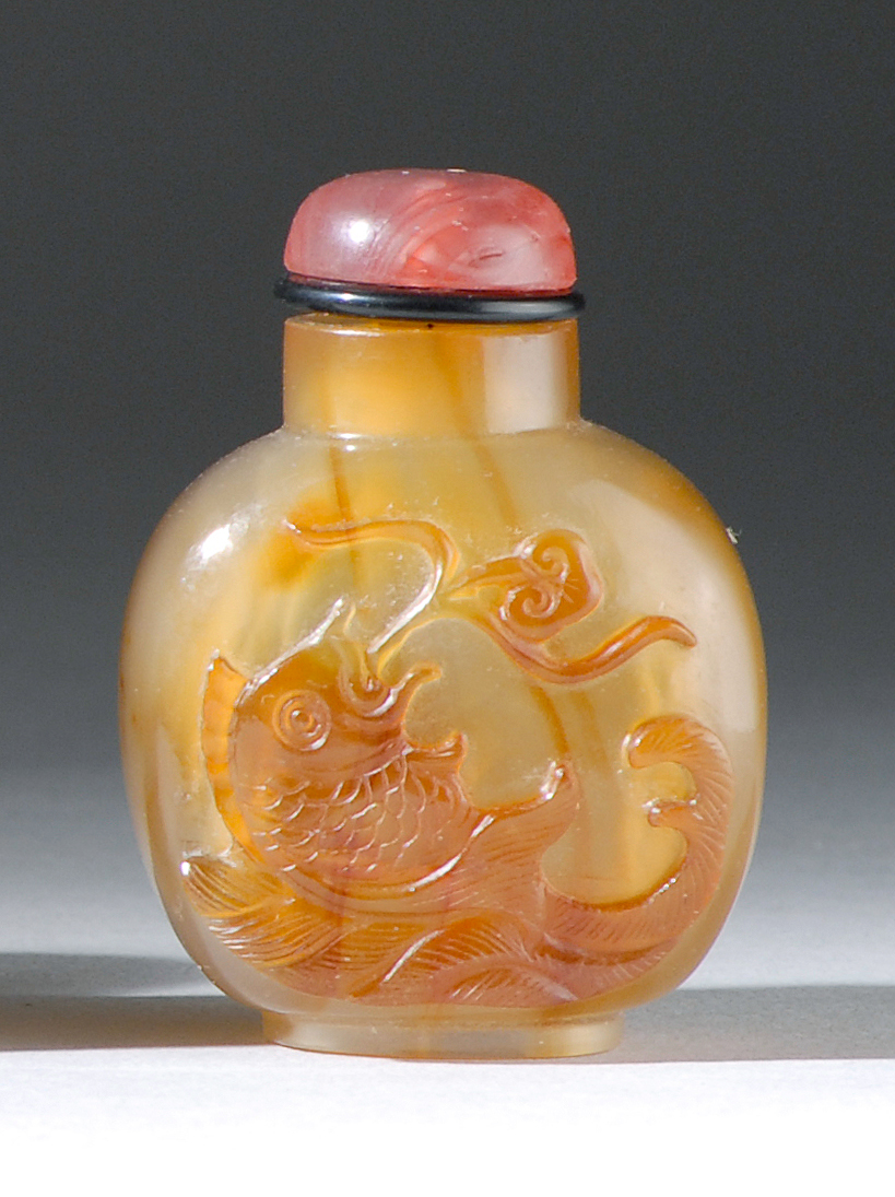 Appraisal: CHALCEDONY AGATE SNUFF BOTTLE th CenturyIn ovoid form with cameo-carved