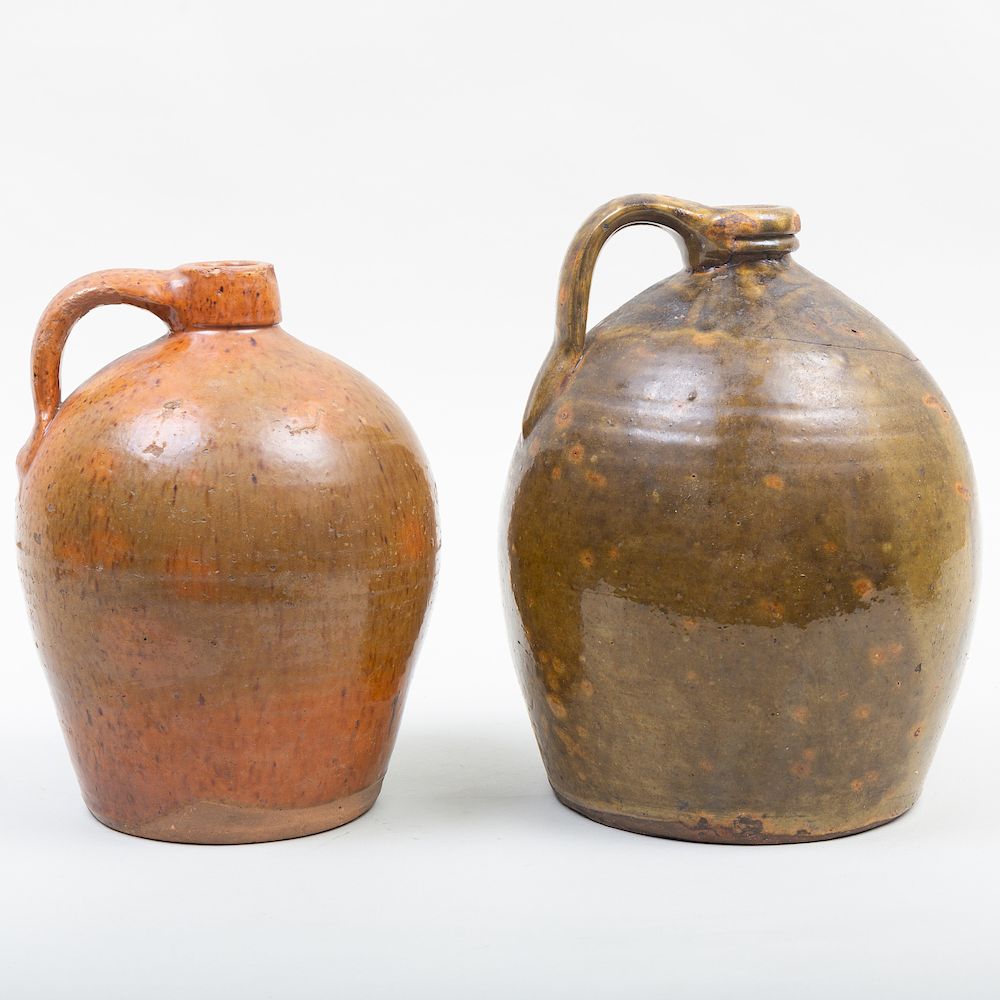 Appraisal: Two American Glazed Pottery Jugs The larger in high Condition