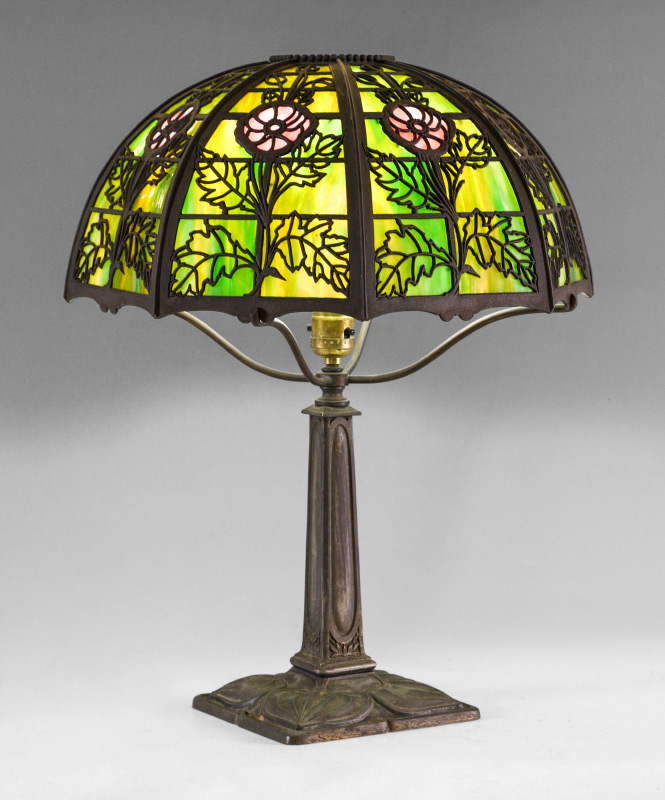 Appraisal: BRADLEY HUBBARD FLORAL SLAG GLASS TABLE LAMP Patinated cast metal