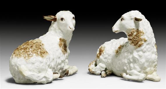 Appraisal: TWO RECLINING SHEEP IN THE STYLE OF MEISSEN LATE TH