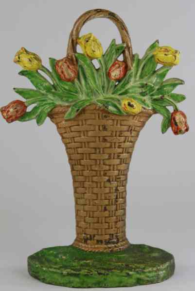 Appraisal: TULIPS IN BASKET DOORSTOP Hubley Cat tall wicker basket design