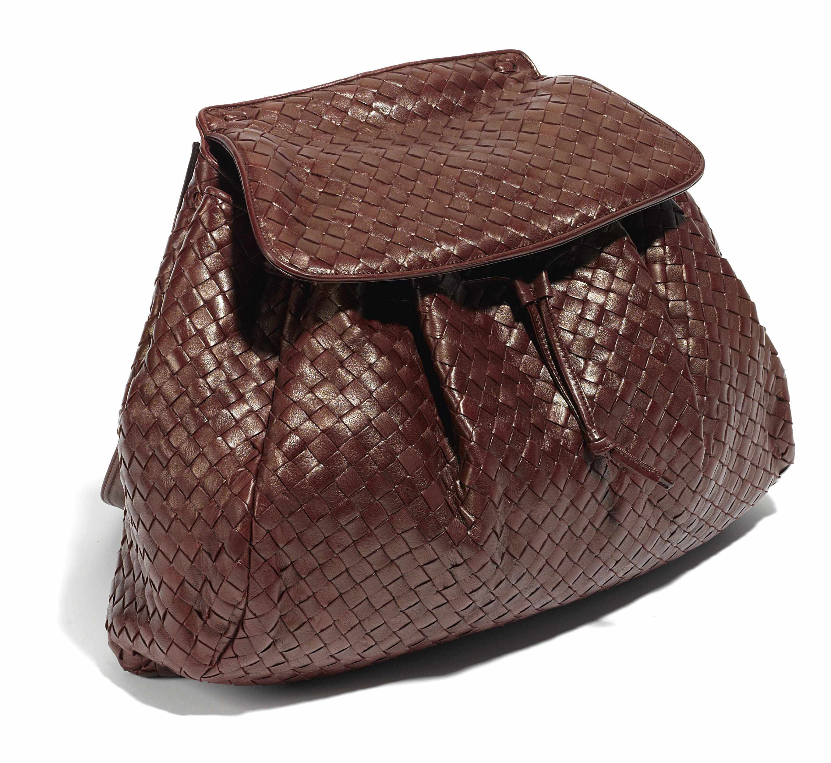 Appraisal: A Bottega Veneta burgundy woven leather handbag x x in