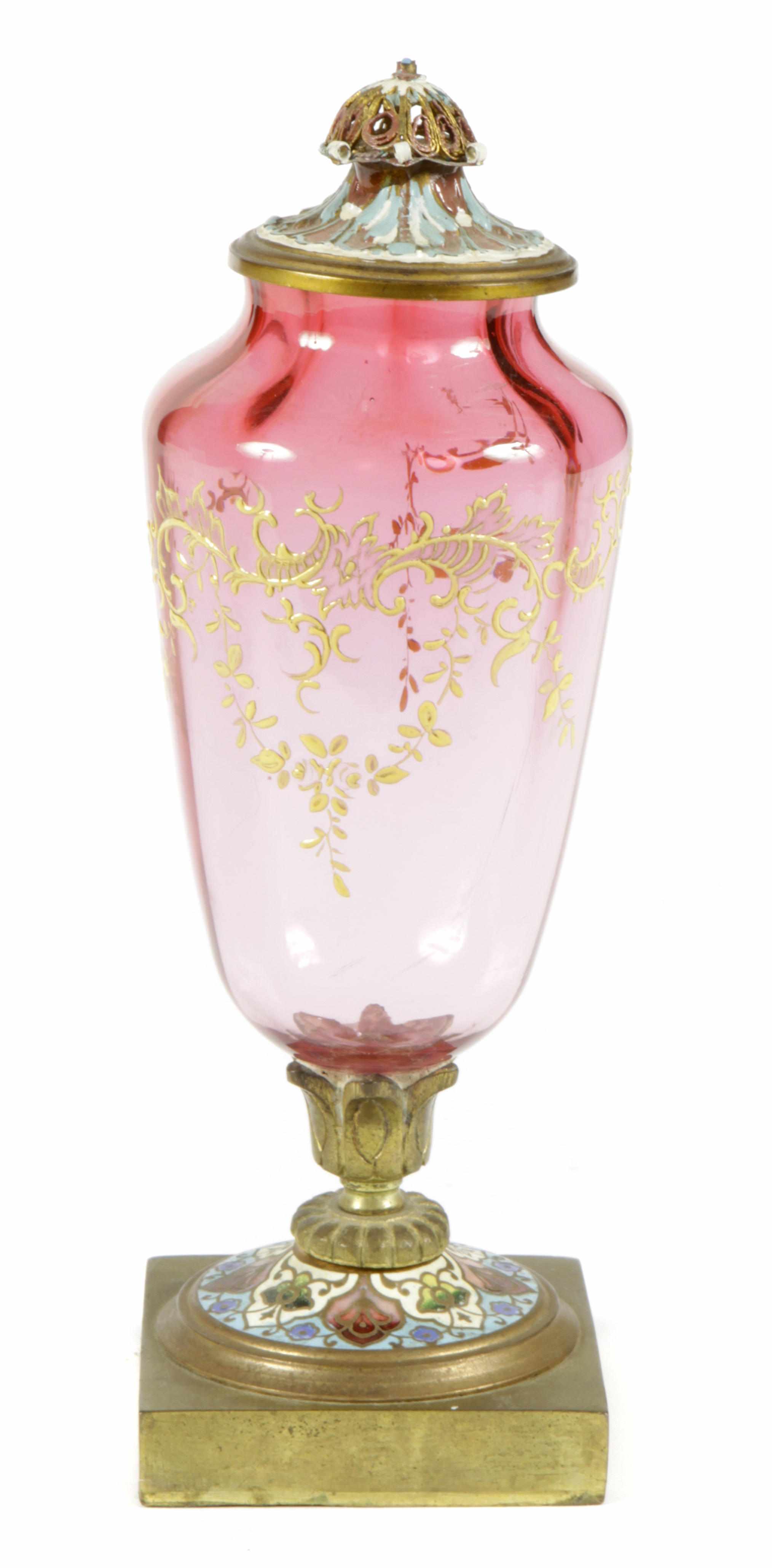 Appraisal: A Continental cranberry glass urn on champleve foot height