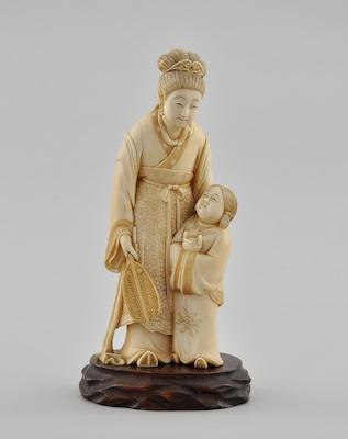 Appraisal: A Carved Ivory Figurine of a Woman and Child Chinese