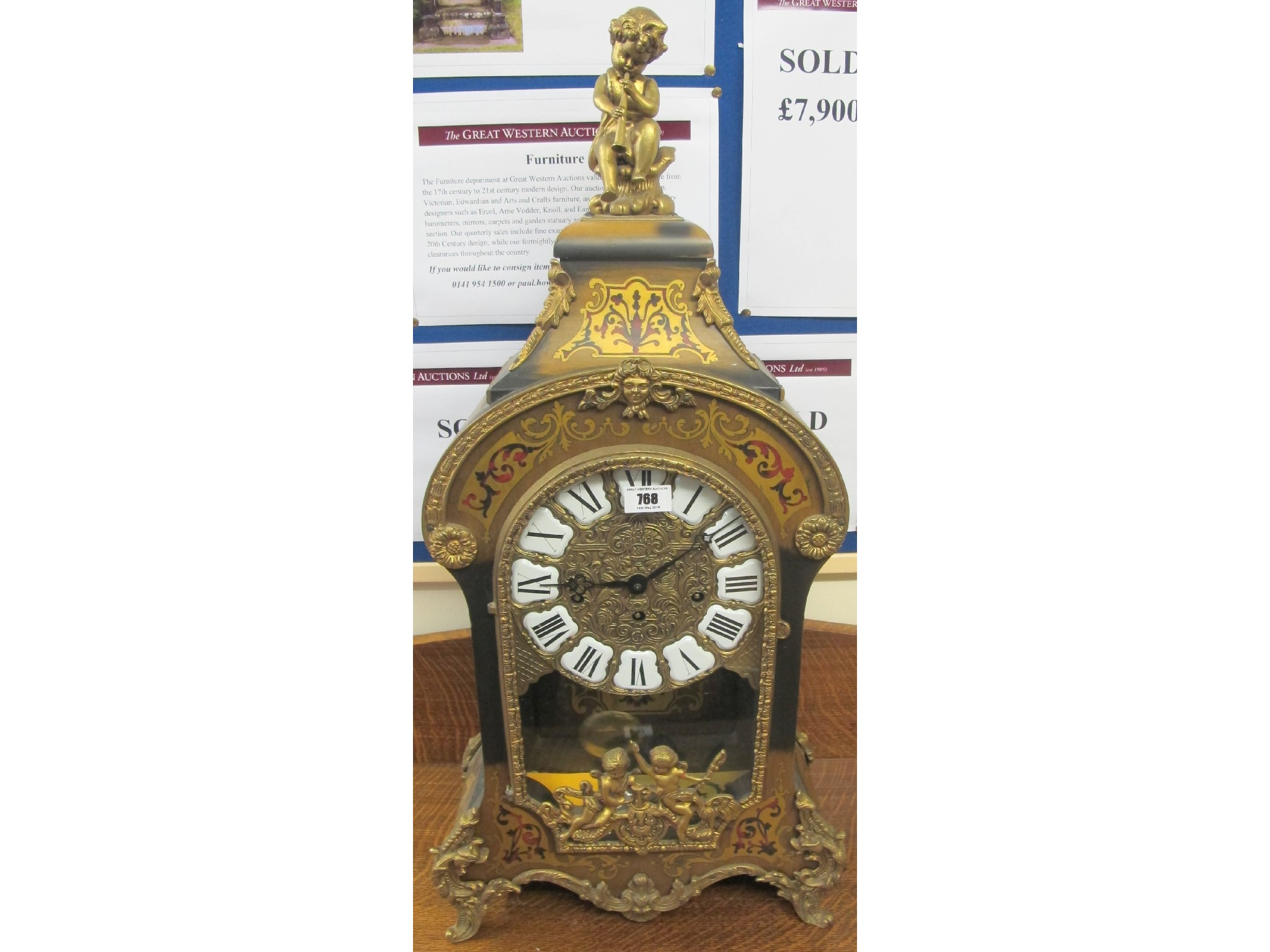 Appraisal: An ornate gilt mantle clock