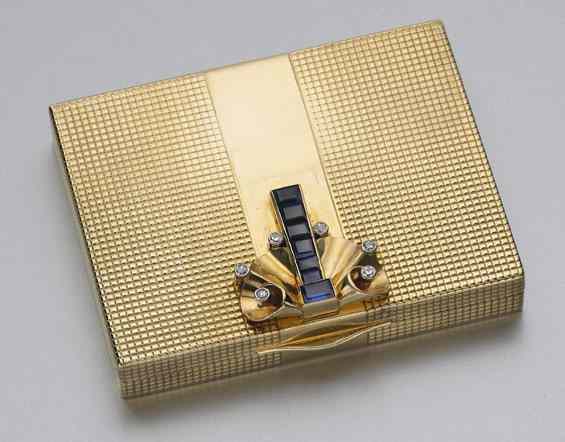 Appraisal: Cartier K gold diamond and sapphire compactwith engine turned body