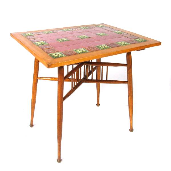 Appraisal: An Arts and Crafts mixed wood center table with tile