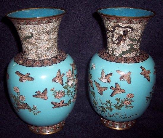 Appraisal: A pair of cloisonn vases decorated birds and chrysanthemums on