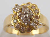 Appraisal: A white and yellow metal tests carat gold diamond cluster