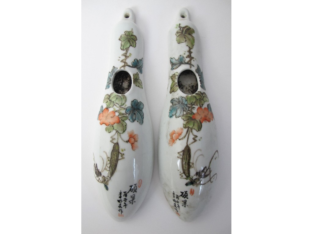 Appraisal: A pair of Chinese gourd shaped wall vases painted with