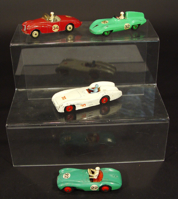 Appraisal: Four Dinky Toys die-cast open top racing cars comprising a