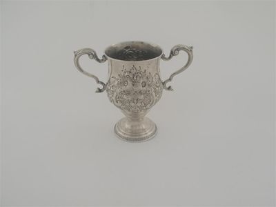 Appraisal: A George III Irish two handled cup with embossed decoration