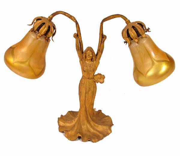 Appraisal: An Art Nouveau gilt-metal figural table lamp has two iridescent