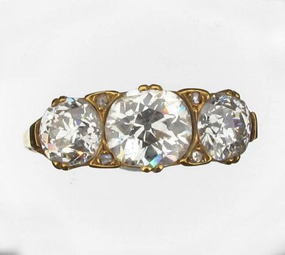 Appraisal: A diamond three stone ring Set in gold with three