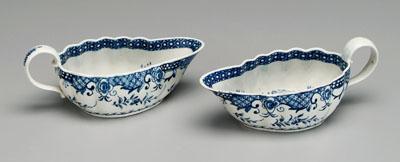 Appraisal: Two Worcester sauceboats interior Asian scenes with pagodas and figures