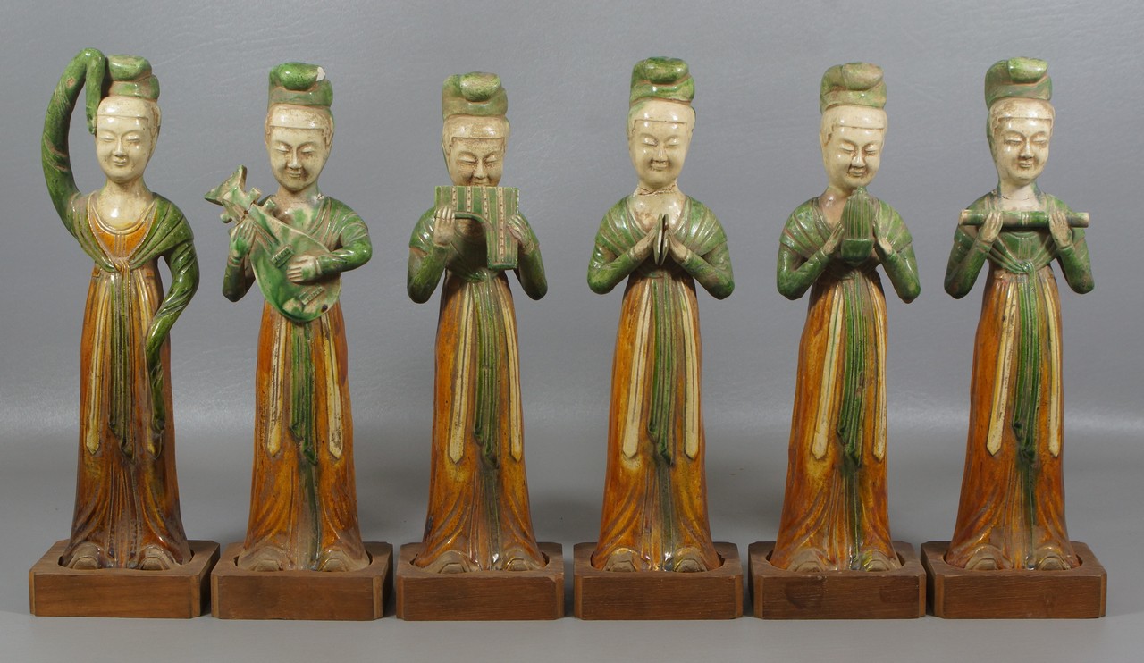 Appraisal: Chinese Sancai glazed figures standing female attendants each holding an