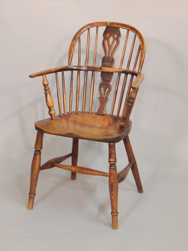 Appraisal: A thC ash and elm Windsor armchair with a solid